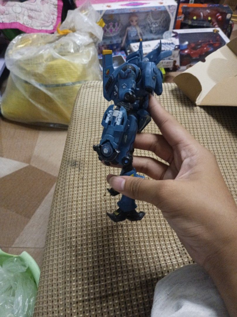 Pacific Rim Romeo Blue Action Figure (Category: Figurines & Statues) located in Tanza. Submitted by --unicorn-- (Listing ID 1461034627, Image 3). Description: - Romeo Blue action figure from Pacific Rim - Striking blue color with yellow accents - Fully articulated joints for dynamic posing - Ideal for fans of the movie - Minor scuffs present on the feet.