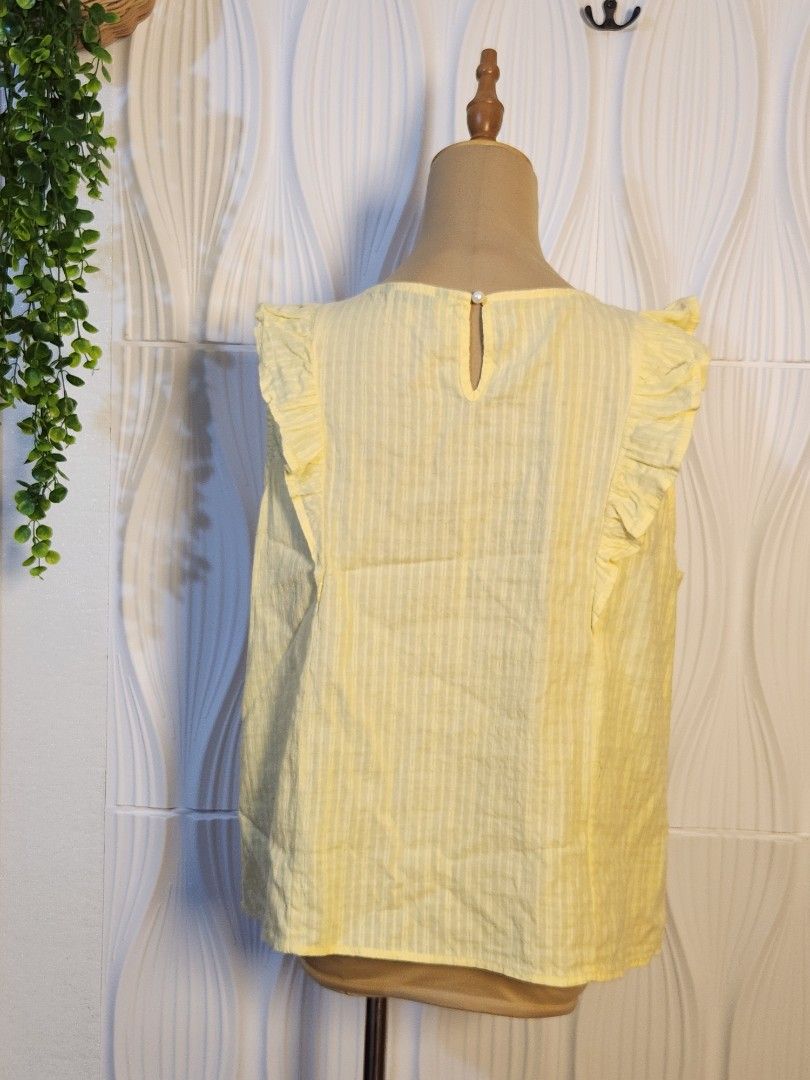 Pastel Yellow Sleeveless (Category: Blouses) located in Marikina City. Submitted by KanamiFinds (Listing ID 1461063408, Image 3). Description: Bust: 42 - 44 inches Length: 21 - 22 inches from the shoulders.