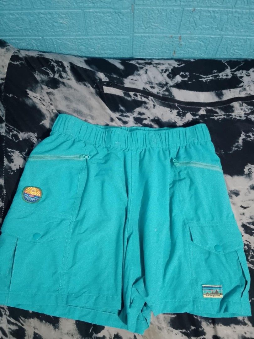 Patagonia Turquoise Cargo Shorts Size S (Category: Shorts) located in Manila. Submitted by solisjethr46316 (Listing ID 1461066967, Image 1). Description: - Patagonia Cargo Shorts - Color: Turquoise - Size: S - Elastic waistband with drawstring - Two front zip pockets - One back button pocket - Small Patagonia logo patch on front and back - Made in Vietnam.