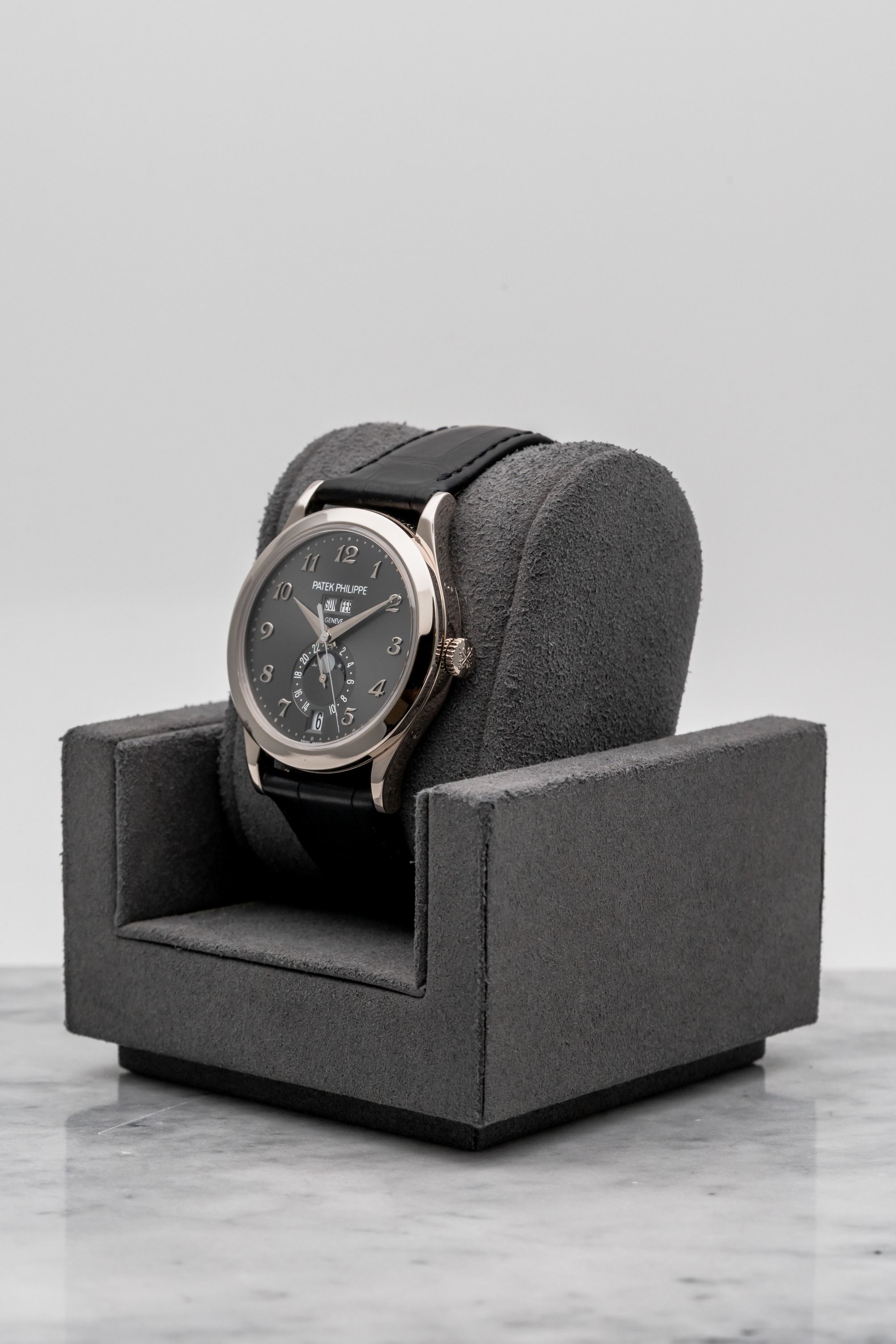 Patek Philippe Annual Calendar 5396G-014 Grey Arabic Dial • 2018 • 📦 & 📄 (Category: Watches) located in Singapore. Submitted by timetells (Listing ID 1460931174, Image 2). Description: Brand: Patek Philippe Model: Annual Calendar Reference Number: 5396G-014 Year: 2018 Case Size: 38.5 mm Case Material: 18K White Gold Dial: Anthracite Grey Dial with Applied White Gold Breguet-Style Arabic Numerals, Day and Month Apertures, Date Display at 6 o'clo