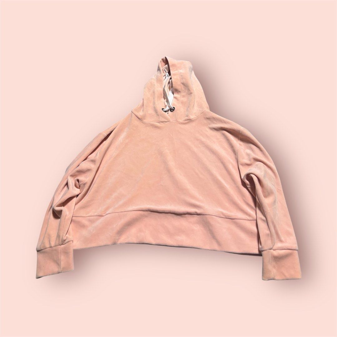 Peach Velour Cropped Hoodie (Category: Coats, Jackets and Outerwear) located in Rosario. Submitted by preloveditems2002 (Listing ID 1461048833, Image 1). Description: - Super soft peach velour fabric - Trendy cropped style - Relaxed fit for comfort - Adjustable drawstring hood - Ribbed cuffs and hem - Perfect for lounging or casual outfits - Feels incredibly cozy!.