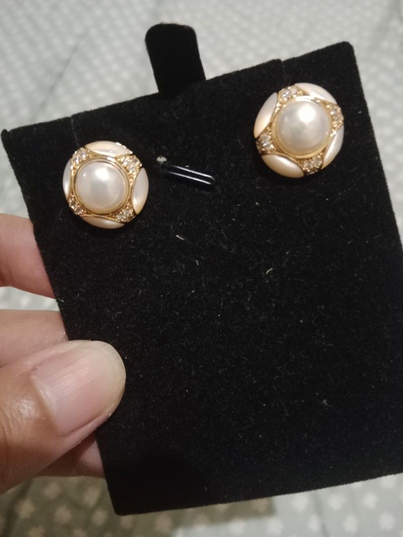 Pearl and Crystal Stud Earrings (Category: Earrings) located in Manila. Submitted by yethquiday (Listing ID 1461077646, Image 2). Description: - Classic round stud earrings - Features a pearl center - Surrounded by sparkling small crystals - Elegant gold-tone border - Versatile for dressing up or everyday wear - Comes with secure backings.