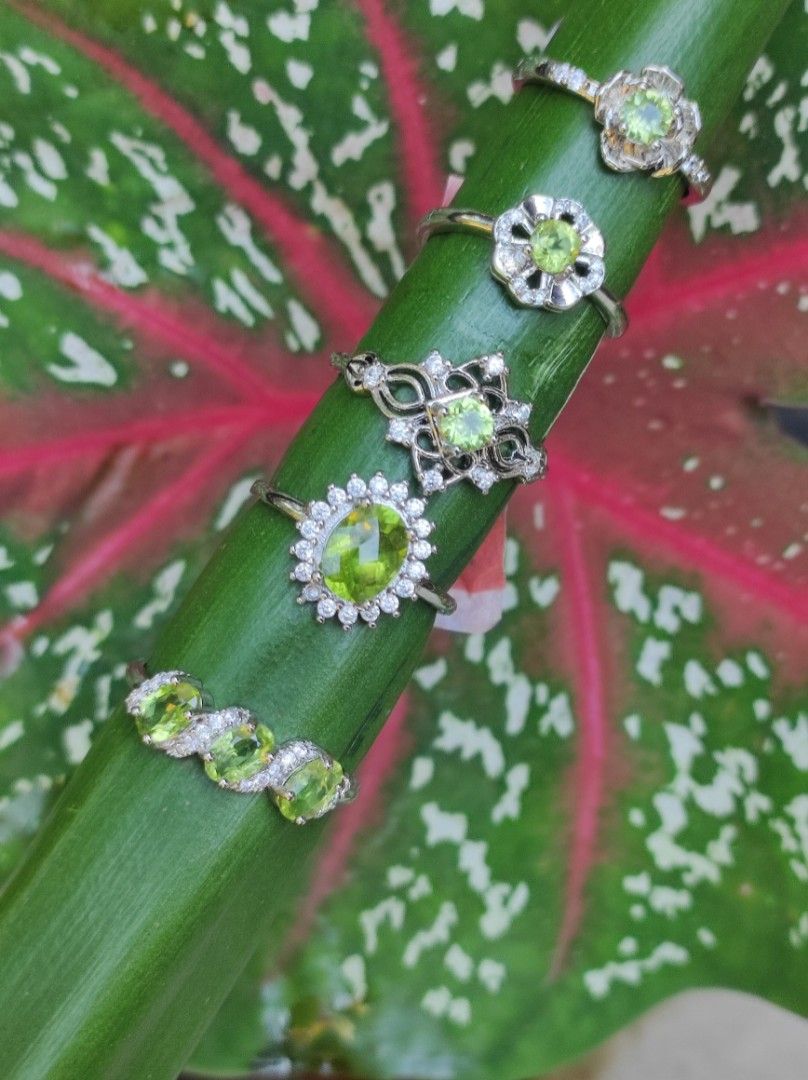 Peridot Gemstone Silver Plated Adjustable Ring (Category: Bracelets) located in Kinoguitan. Submitted by artemiscrystal (Listing ID 1460970071, Image 1). Description: -Peridot rings Silver plated adjustable size. -Price: 120-250 😱 1. 3 stones : 250 2. Big stone : 220 3. Eye : 120 4/5.flower: 120 -Mineral Properties: Gem quality variety of the mineral olivine,known for its distinct lime to olive green color. -Metaphysical Properties: Emotional de