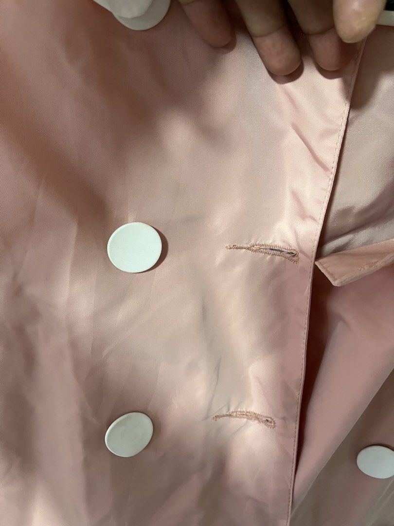 Pink Double-Breasted Jacket with White Collar (Category: Coats, Jackets and Outerwear) located in Pasig City. Submitted by melaiski28 (Listing ID 1460997781, Image 2). Description: - Adorable pink jacket - Features a chic white collar - Stylish double-breasted design - Large white button details - Made from a lightweight, slightly shiny fabric - Ideal for layering - Versatile for casual or dressy occasions.