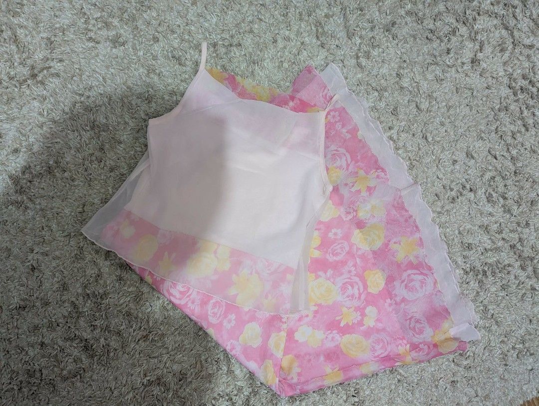 Pink Floral Spaghetti Strap Dress (Category: Dresses) located in Manila. Submitted by drei_thrift (Listing ID 1460964951, Image 2). Description: - Adorable pink dress with a charming floral print. - Features a light pink camisole top layered over a flowy skirt. - Delicate spaghetti straps. - Gathered waist for a flattering fit. - Ideal for casual days or beach adventures. - Made from lightweight, breathable fabric..