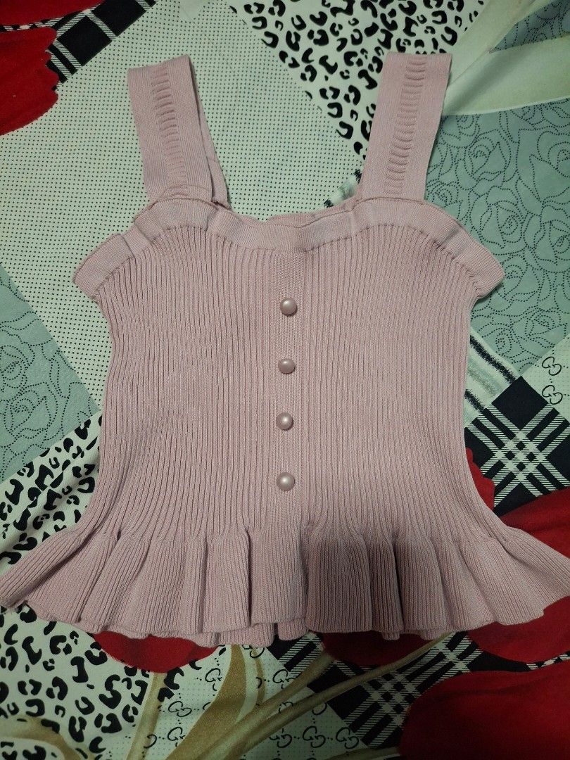 Pink Ribbed Cold Shoulder Top with Ruffle Detail (Category: Blouses) located in Plaridel. Submitted by niannyyy (Listing ID 1461037206, Image 2). Description: - Adorable pink ribbed top - Chic cold shoulder design with ruffled edges - Four pearl-like buttons down the front - Stretchy and comfortable material - Perfect for both casual outings and dressier events.