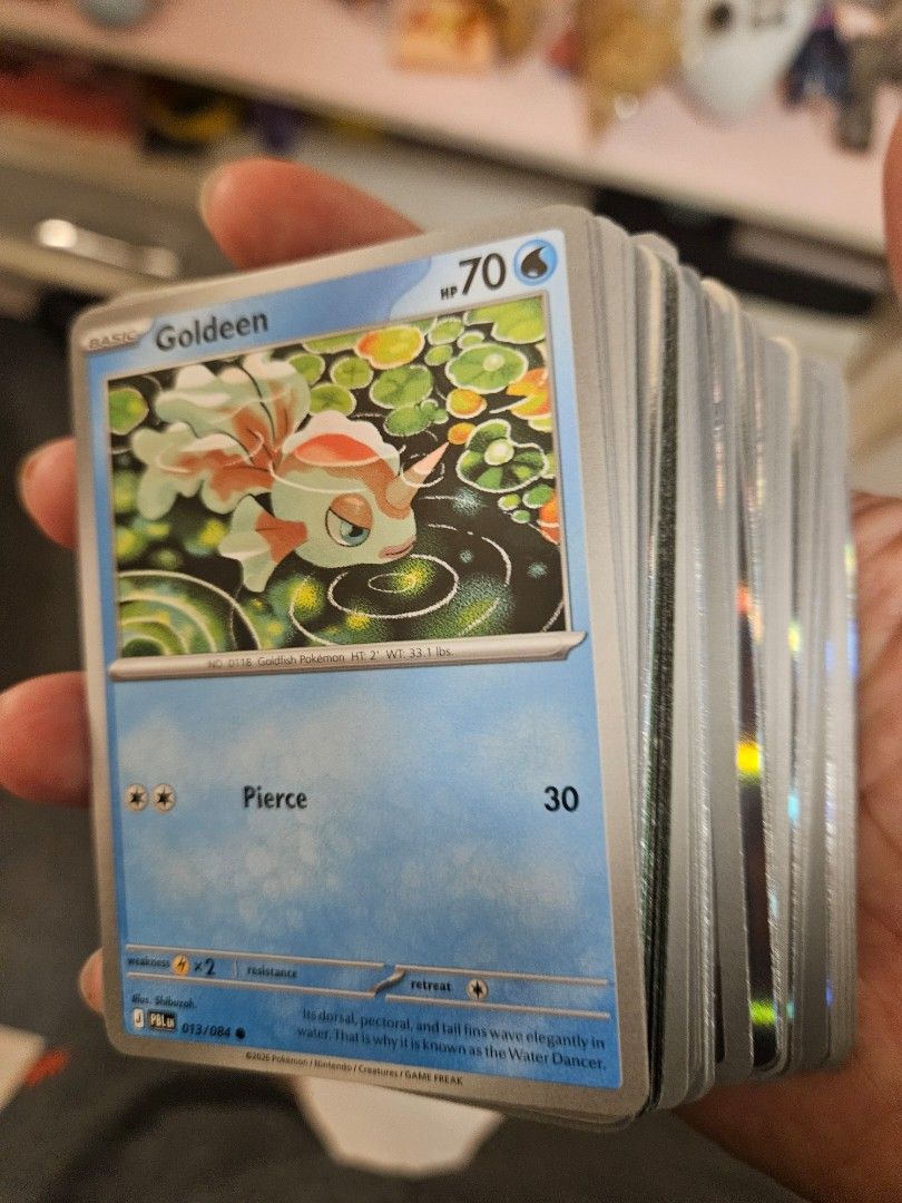 Pokemon pitch black 150 pcs (Category: Raw Singles) located in Taguig. Submitted by gowilliam.767 (Listing ID 1461102280, Image 1). Description: - Stack of Pokemon trading cards available. - Features a Goldeen card with 70 HP. - Includes numerous other Pokemon cards. - Ideal for both collectors and players. - All cards display the classic Pokemon back design. - Feel free to ask any questions..