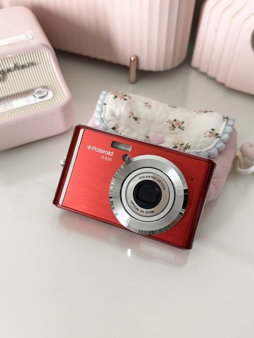 Polaroid iS426 Digital Camera Red Digicam Y2K (Category: Cameras) located in Marilao. Submitted by toutlemonde (Listing ID 1461082473, Image 1). Description: - 16MP CCD sensor - 4x optical zoom - can take photos/ videos - 9/10 cosmetic condition - uses SD card (not included) Issue: no functional issue Inclusions: battery, universal charger, pouch, troubleshoot card Location: Marilao, Bulacan MOD: J&T / LBC / Meetup (+₱220hf SM north/ trinoma) MOP