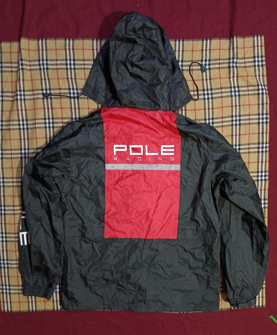 POLE RACING Jacket Black Red (Category: Activewear) located in General Santos City (Dadiangas). Submitted by freehorse.5f2a61 (Listing ID 1460966190, Image 2). Description: - POLE RACING jacket in black with striking red accents. - Features the "POLE RACING" logo prominently on the front and sleeves. - Two secure front pockets with button closure. - Adjustable straps at the waist and cuffs for a customized fit. - Comfortable mesh lining inside. -
