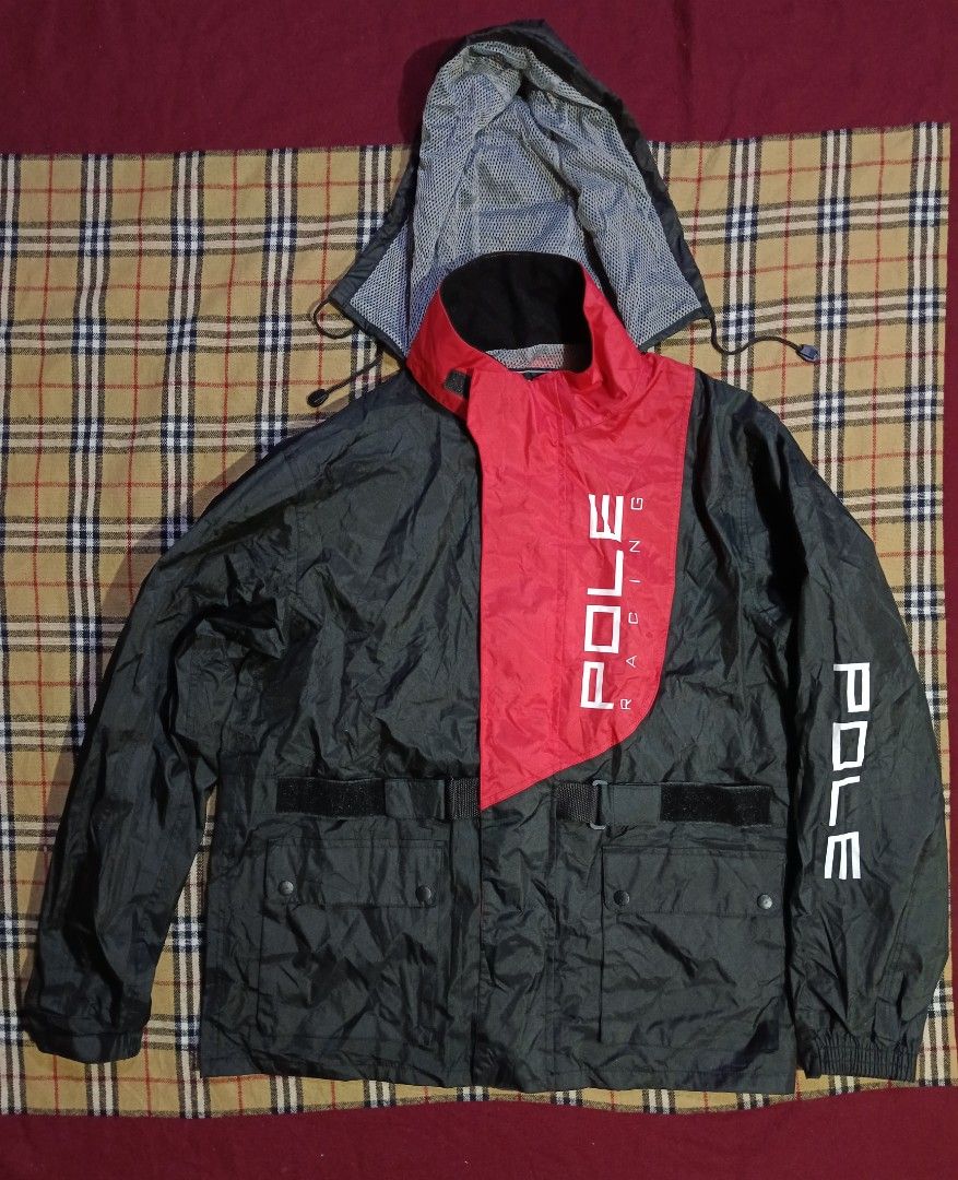 POLE RACING Jacket Black Red (Category: Activewear) located in General Santos City (Dadiangas). Submitted by freehorse.5f2a61 (Listing ID 1460966190, Image 3). Description: - POLE RACING jacket in black with striking red accents. - Features the "POLE RACING" logo prominently on the front and sleeves. - Two secure front pockets with button closure. - Adjustable straps at the waist and cuffs for a customized fit. - Comfortable mesh lining inside. -