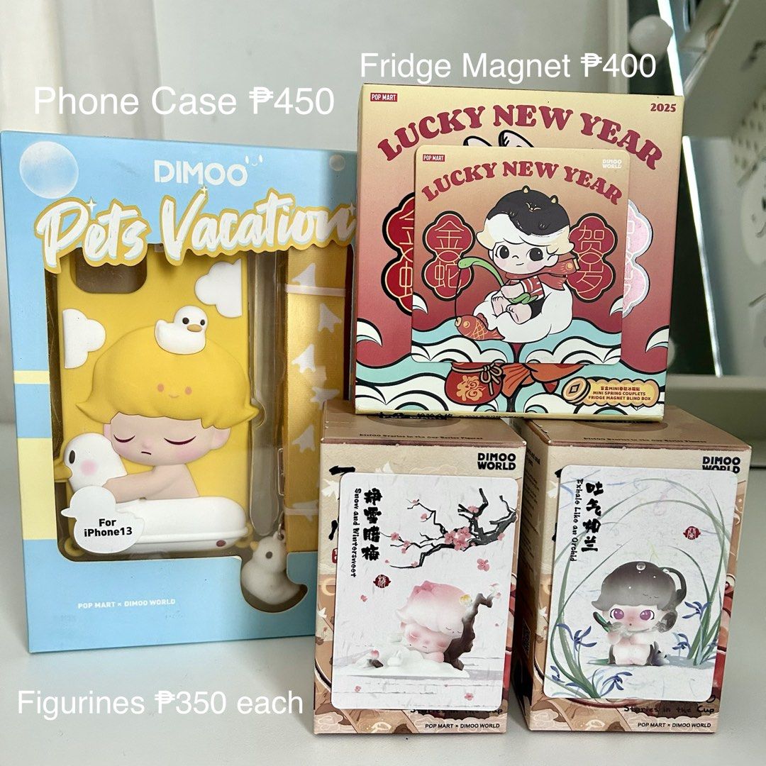 Pop Mart Dimoo Phone Case, Fridge Magnet & Figurines (Category: Designer & Blind Box Toys) located in Cavite. Submitted by yamyam. (Listing ID 1461114536, Image 1). Description: - Pop Mart Dimoo 'Pets Vacation' Phone Case for iPhone 13 - Pop Mart Dimoo 'Lucky New Year' Fridge Magnet - Pop Mart Dimoo 'Snow and Wintersweet' Figurine - Pop Mart Dimoo 'Exhale Like an Orchid' Figurine - Prices are indicated in the product image. - Send a message if yo