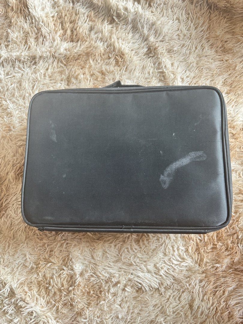 Portable Make Up Bag Organizer (Category: Accessory Holder, Box & Organizers) located in Quezon City. Submitted by ronavillezar (Listing ID 1461035520, Image 3). Description: - Portable makeup bag organizer - Color: Black - Features adjustable dividers for customizable storage - Includes a built-in mirror - Ideal for makeup artists and personal use - Keeps your cosmetics organized and protected - Pwede isabit sa luggage - Need lang laundry - Size