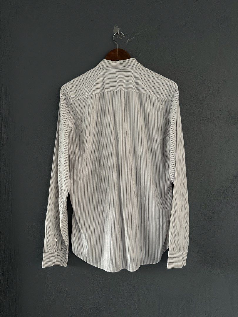 Prada - Pinstripe Long Sleeves shirt (Category: Formal Shirts) located in Pasig City. Submitted by worn2wice (Listing ID 1461003996, Image 2). Description: Size 41EUR Measurements (in) Width 22.5 Length 29/30 Sleeve Length 27 Very good condition Issue: Scratches/small holes on the collar part No copyright infringement intended. This post is for resale purposes only. All trademarks, logos, and brand names belong to their respective owners..