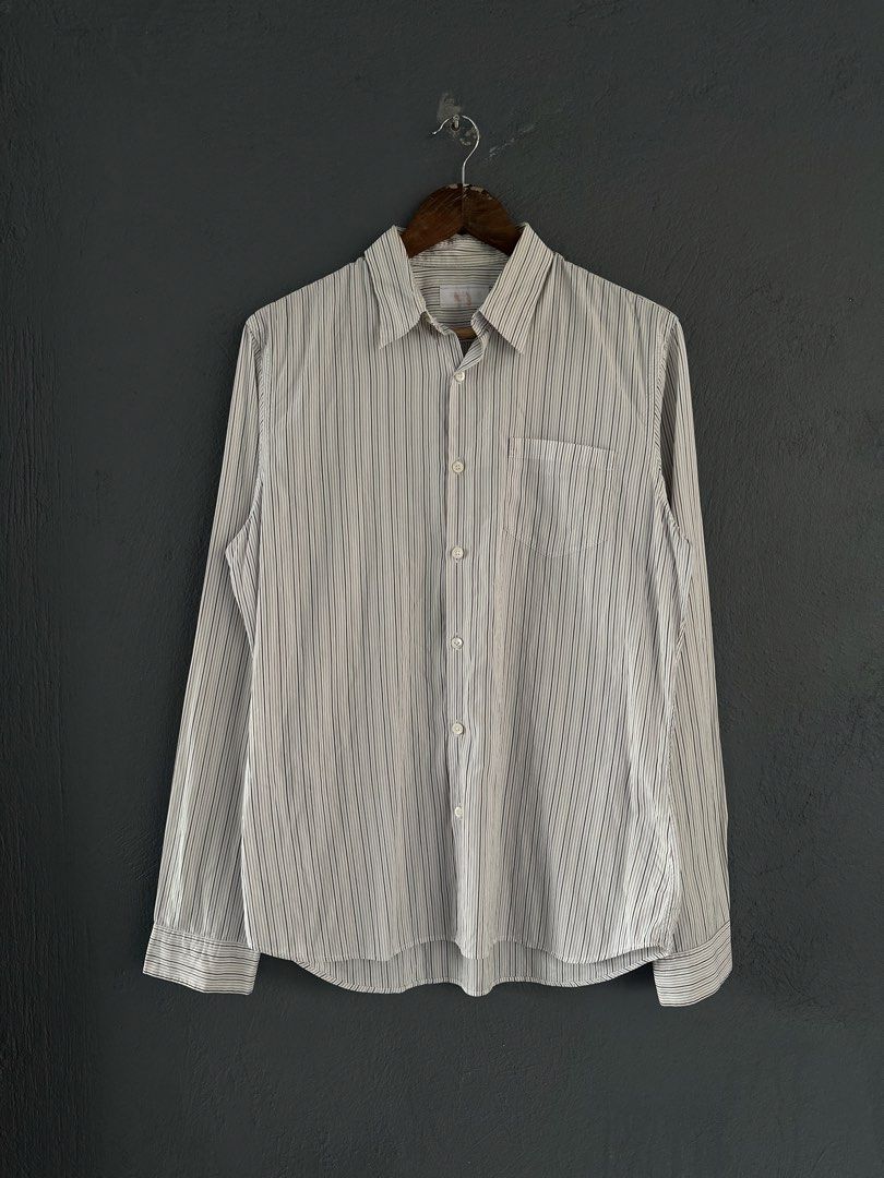 Prada - Pinstripe Long Sleeves shirt (Category: Formal Shirts) located in Pasig City. Submitted by worn2wice (Listing ID 1461003996, Image 1). Description: Size 41EUR Measurements (in) Width 22.5 Length 29/30 Sleeve Length 27 Very good condition Issue: Scratches/small holes on the collar part No copyright infringement intended. This post is for resale purposes only. All trademarks, logos, and brand names belong to their respective owners..
