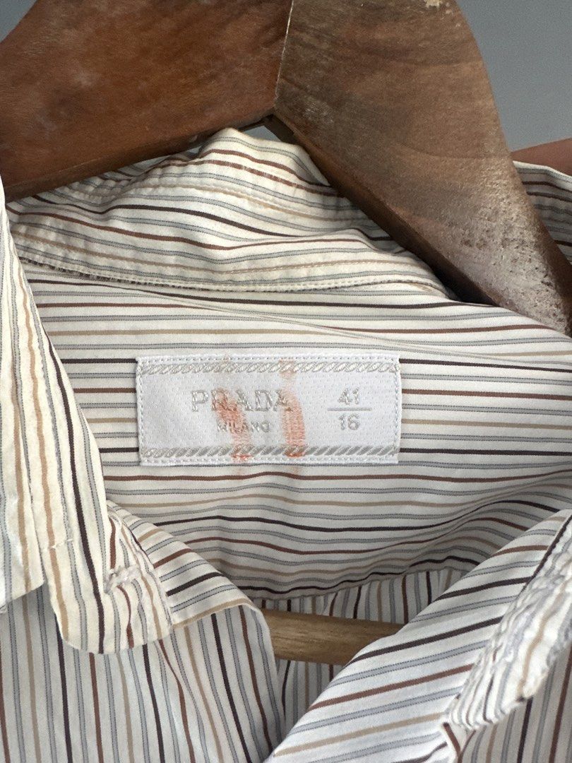 Prada - Pinstripe Long Sleeves shirt (Category: Formal Shirts) located in Pasig City. Submitted by worn2wice (Listing ID 1461003996, Image 3). Description: Size 41EUR Measurements (in) Width 22.5 Length 29/30 Sleeve Length 27 Very good condition Issue: Scratches/small holes on the collar part No copyright infringement intended. This post is for resale purposes only. All trademarks, logos, and brand names belong to their respective owners..