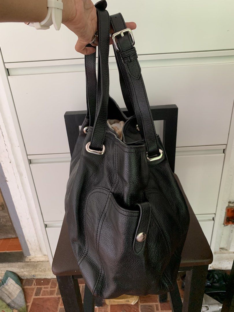 Prada Black Leather Tote Bag (Category: Luxury Bags & Wallets) located in Taguig. Submitted by madisam (Listing ID 1460971831, Image 2). Description: Prada likenew Leather (Authenticity is not guarantee) Size Height:12 inches Widht:19 inches .
