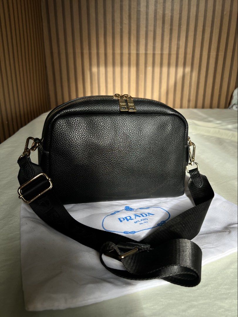 Prada Double Zip Camera Bag (Category: Cross-body Bags) located in Imus. Submitted by vdc.apparel (Listing ID 1460923361, Image 1). Description: Black textured leather Prada Double Zip Camera Bag crafted in Vitello Daino or Phenix leather with gold-tone hardware..