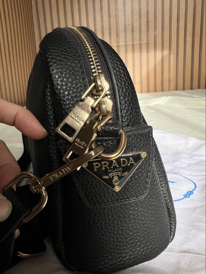 Prada Double Zip Camera Bag (Category: Cross-body Bags) located in Imus. Submitted by vdc.apparel (Listing ID 1460923361, Image 3). Description: Black textured leather Prada Double Zip Camera Bag crafted in Vitello Daino or Phenix leather with gold-tone hardware..