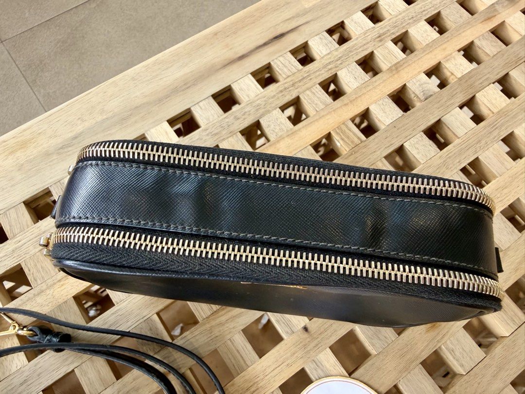 Prada double zip Saffiano crossbody bag (Category: Luxury Bags & Wallets) located in Cagayan de Oro. Submitted by moiobsession (Listing ID 1460973275, Image 2). Description: fits big phones, wallet and more with dustbag authentic Guaranteed moiobsession.com watspp O9O5272489five blueapp: Arra Gomez IG: secondhandbymoiobsession.