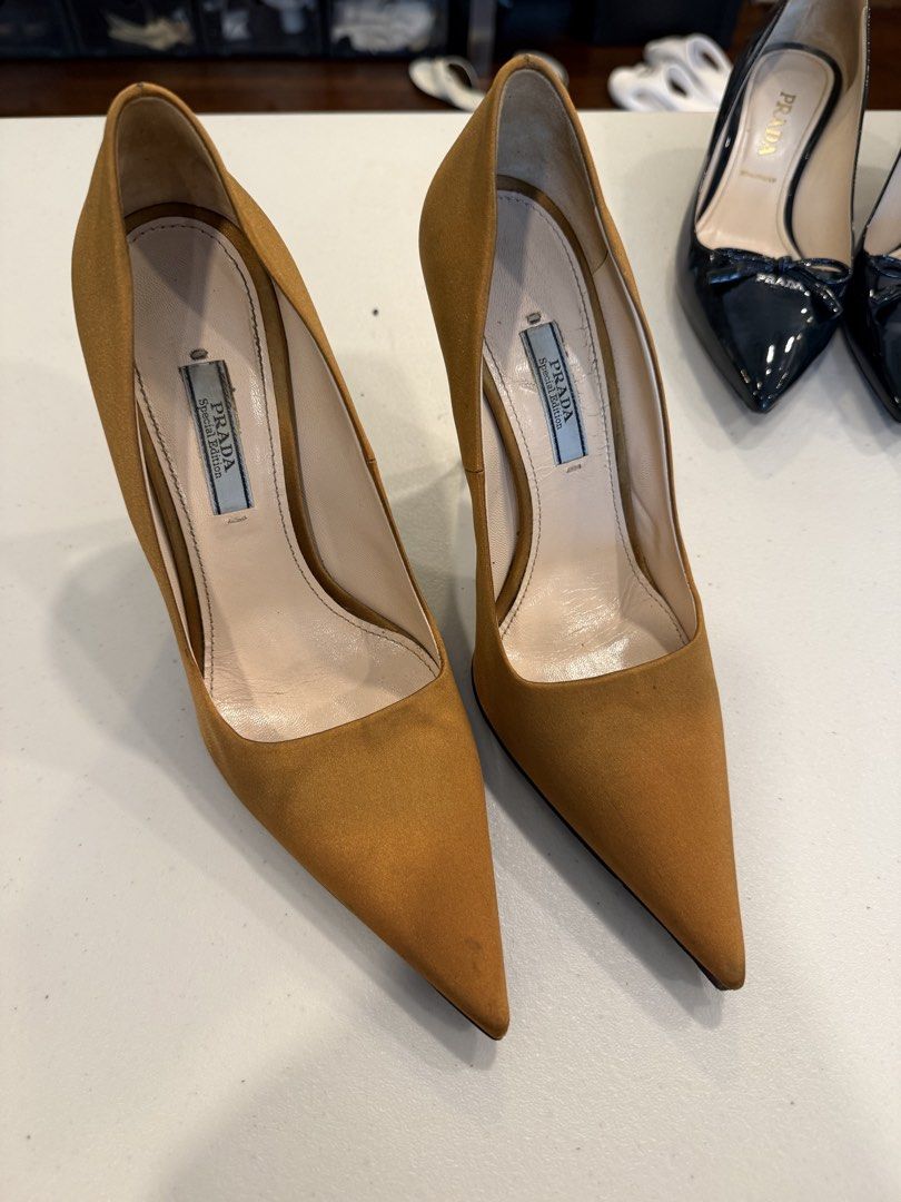 PRADA GOLDEN BROWN SATIN PUMPS ✨ (Category: Sneakers & Footwear) located in Pasig City. Submitted by marketplacesellinginc (Listing ID 1460991841, Image 1). Description: Selling my Prada pointed-toe satin pumps in a beautiful golden brown/mustard shade. Classic, elegant, and perfect for weddings, formal events, or dressing up an outfit. 🤎 👠 Brand: Prada 📏 Size: 37 IT 🎨 Color: Golden Brown / Mustard ✨ Material: Satin 🇮🇹 purchased in Italy, M
