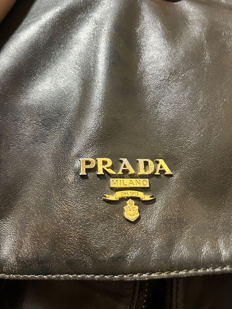 Vintage Prada Tessuto Double-buckle Messenger Bag (Category: Luxury Bags & Wallets) located in Caloocan City. Submitted by rosh1923 (Listing ID 1461036619, Image 2). Description: -PRADA Vintage Messenger Bag - Dark brown leather front flap with gold hardware - Green nylon body - Adjustable shoulder strap - Multiple pockets for organization - Zippers work smoothly (two zippers don't have pullers) - Ideal for daily use - Please see photos for your 