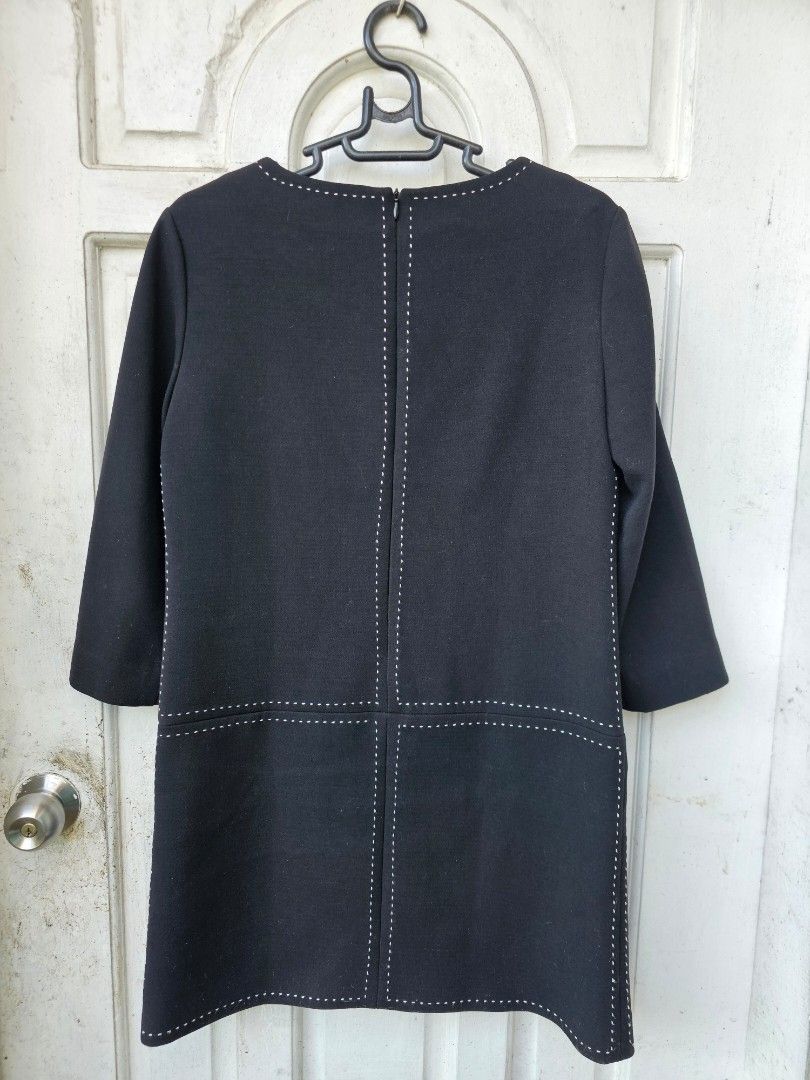 PRADA MILANO Black Dress Size M (Category: Dresses) located in Tagbilaran City. Submitted by lugarpogi (Listing ID 1460965170, Image 2). Description: - Brand: Prada - Size: M - Made in: Italy - Material: 70% Cotton, 30% Silk - Features: White contrast stitching on neckline, hem, and pockets - Closure: Back zipper - Style: Classic and chic.