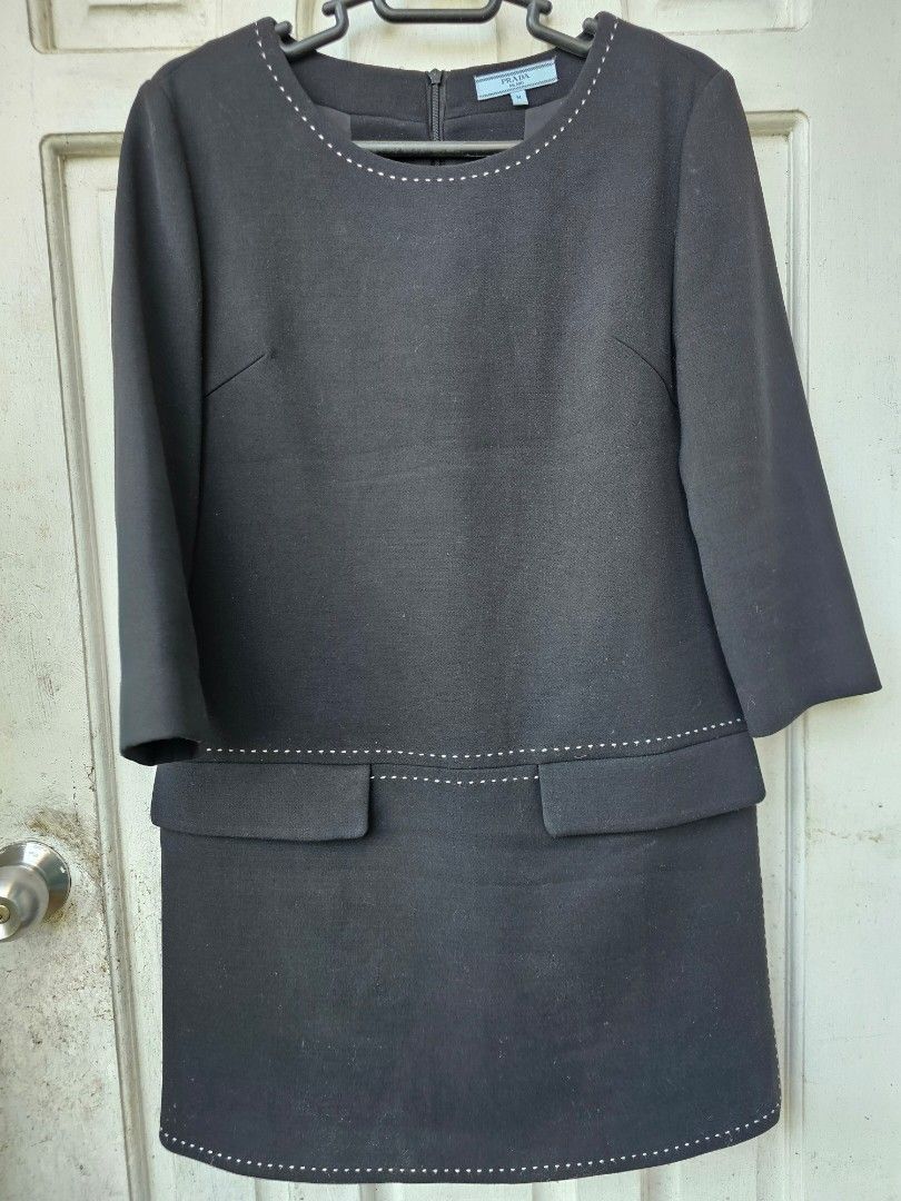 PRADA MILANO Black Dress Size M (Category: Dresses) located in Tagbilaran City. Submitted by lugarpogi (Listing ID 1460965170, Image 1). Description: - Brand: Prada - Size: M - Made in: Italy - Material: 70% Cotton, 30% Silk - Features: White contrast stitching on neckline, hem, and pockets - Closure: Back zipper - Style: Classic and chic.