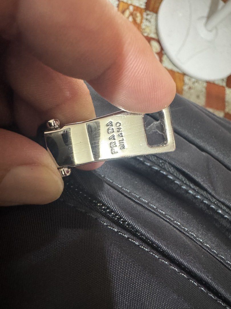 Prada Nylon Belt Bag Black (Category: Luxury Bags & Wallets) located in Manila. Submitted by wildbear.e10374 (Listing ID 1460961724, Image 2). Description: - Authentic Prada Belt Bag - Color: Black - Material: Nylon - Iconic Prada Logo Plaque - Multiple Zippered Compartments - Adjustable Strap with Buckle Closure - Ideal for Everyday Use or Travel - Note: Shows some signs of wear on the hardware.