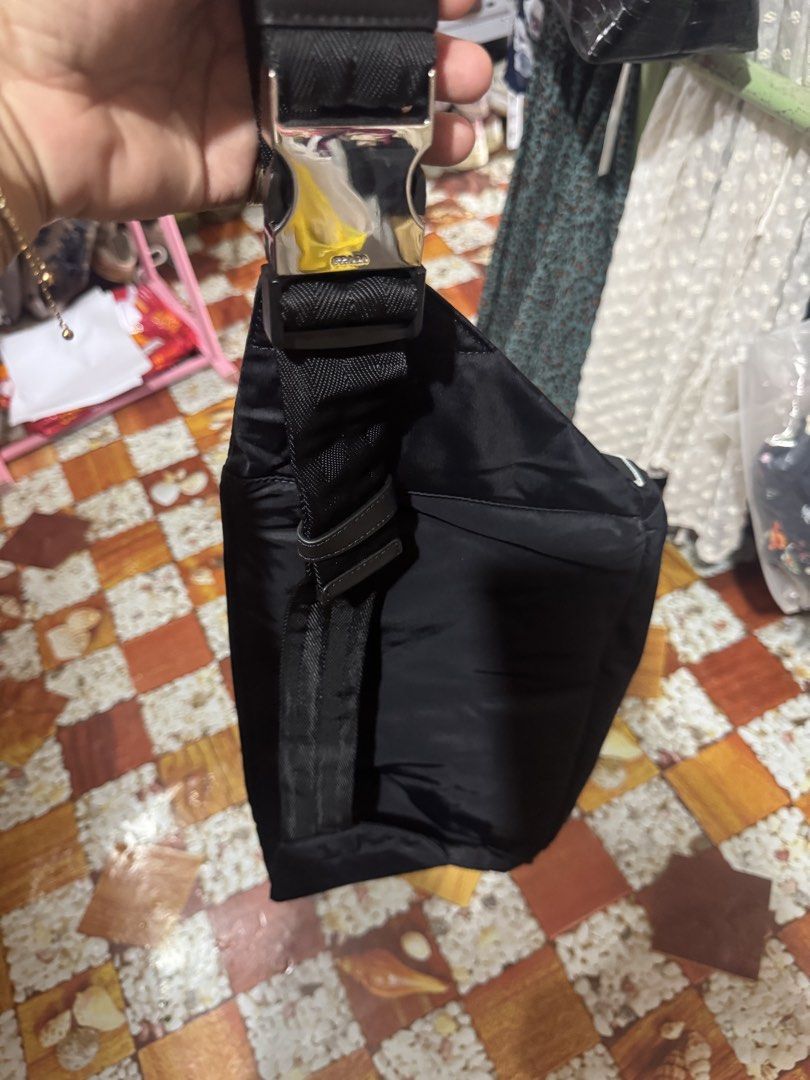 Prada Nylon Belt Bag Black (Category: Luxury Bags & Wallets) located in Manila. Submitted by wildbear.e10374 (Listing ID 1460961724, Image 3). Description: - Authentic Prada Belt Bag - Color: Black - Material: Nylon - Iconic Prada Logo Plaque - Multiple Zippered Compartments - Adjustable Strap with Buckle Closure - Ideal for Everyday Use or Travel - Note: Shows some signs of wear on the hardware.