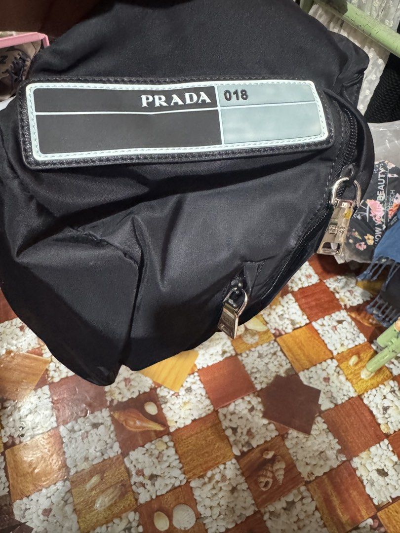 Prada Nylon Belt Bag Black (Category: Luxury Bags & Wallets) located in Manila. Submitted by wildbear.e10374 (Listing ID 1460961724, Image 1). Description: - Authentic Prada Belt Bag - Color: Black - Material: Nylon - Iconic Prada Logo Plaque - Multiple Zippered Compartments - Adjustable Strap with Buckle Closure - Ideal for Everyday Use or Travel - Note: Shows some signs of wear on the hardware.