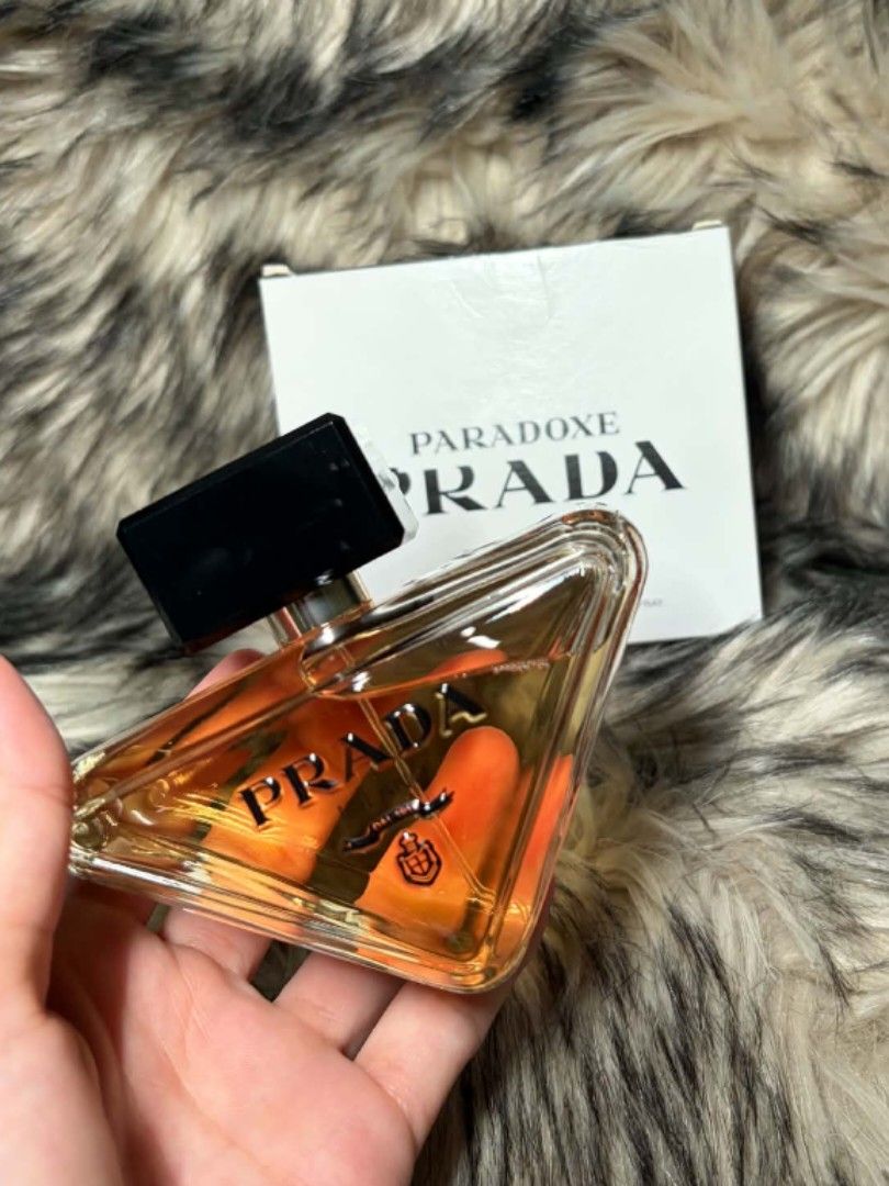 Prada Paradoxe Eau de Parfum 90ml (Category: Fragrance & Deodorants) located in Manila. Submitted by the_realmgrace (Listing ID 1460932604, Image 1). Description: - Authentic Prada Paradoxe edp 90ml - Original US Tr bottle - Comes with box - Unique triangular bottle design - Warm, amber fragrance notes - Versatile for everyday or special occasions .