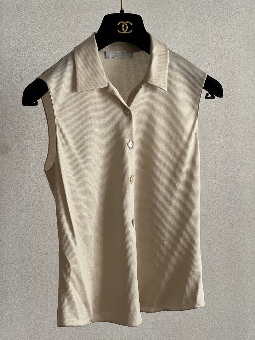 Prada Spring 1997 silk top (Category: Luxury Apparel) located in Quezon City. Submitted by raccoonfur (Listing ID 1460973570, Image 2). Description: Vintage Prada silk jersey sleeveless top. Utterly chic with its peak minimalist silhouette and slinky material. Has a stretch to it. Some subtle snags. Great condition nonetheless. Flat measurements: Pit to pit 39cm/15.25in Waist 36cm/14.15in Length 53.5cm/21in.