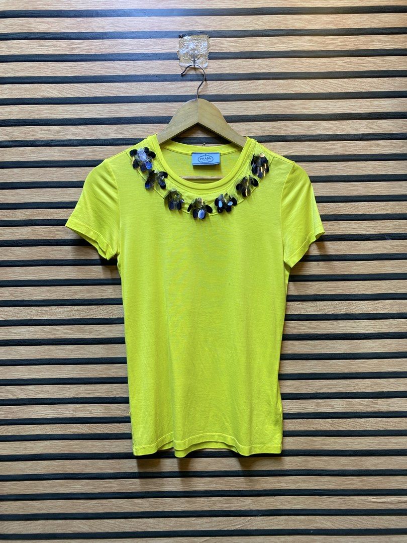 PRADA TEE (Category: Shirts) located in Makati City. Submitted by drip.poww (Listing ID 1461092326, Image 1). Description: - Authentic Prada milano - Color: Yellow - Size: Small - Dimes: 19x24 - Authentic - Excellent condition - Need wash, fresh from bale - Material: 100% Cotton Please don’t expect too much—these are thrifted (ukay) items. 😊 !!STILL NEGOTIABLE!!.