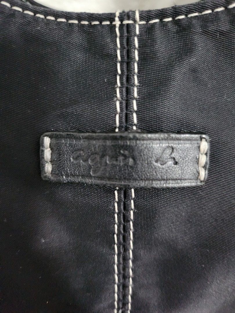 Preloved Agnés b. Voyage nylon bag (Category: Luxury Bags & Wallets) located in Cainta. Submitted by earthangeltin (Listing ID 1460954076, Image 2). Description: Preloved but well-loved Agnés b. Voyager nylon shoulder bag Super spacious Reason for Selling: Decluttering too many bags Can do same day delivery via Lalamove or Grab. Outside of Metro Manila shipping via Gogo Xpress or JnT. Shipping fee shouldered by the buyer.