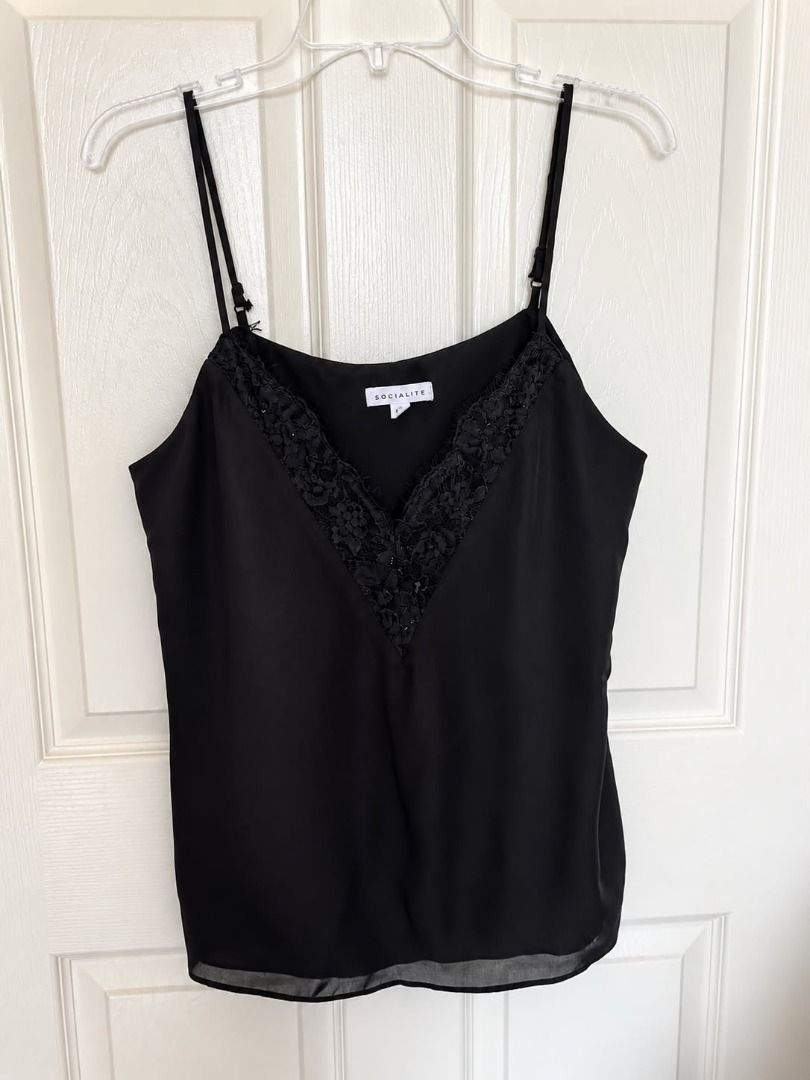 Preloved Black Lace Trim Cami Top (Category: Sleeveless) located in Cebu City. Submitted by classy82 (Listing ID 1460925866, Image 3). Description: - Cute black camisole - Delicate lace trim along the neckline - Adjustable spaghetti straps for a perfect fit - Sheer hem detail for a touch of elegance - Versatile: pairs well with jeans or skirts - Ideal for layering or wearing as a standalone piece.