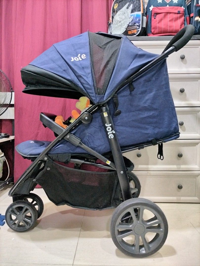 Preloved Navy blue Joie Litetrax 3 Stroller (Category: Strollers) located in Taguig. Submitted by wearepreloved83 (Listing ID 1461062958, Image 3). Description: Preloved Navy blue Joie Litetrax 3 Stroller Multi-position reclining seat suitable from newborn up to toddler 35kg. Featuring a 3-wheel design, an adjustable sun canopy with mesh windows, and a safety bumper bar. Good Condition Heavyduty Stroller Not faded Sign of usage bawal sa maselan N