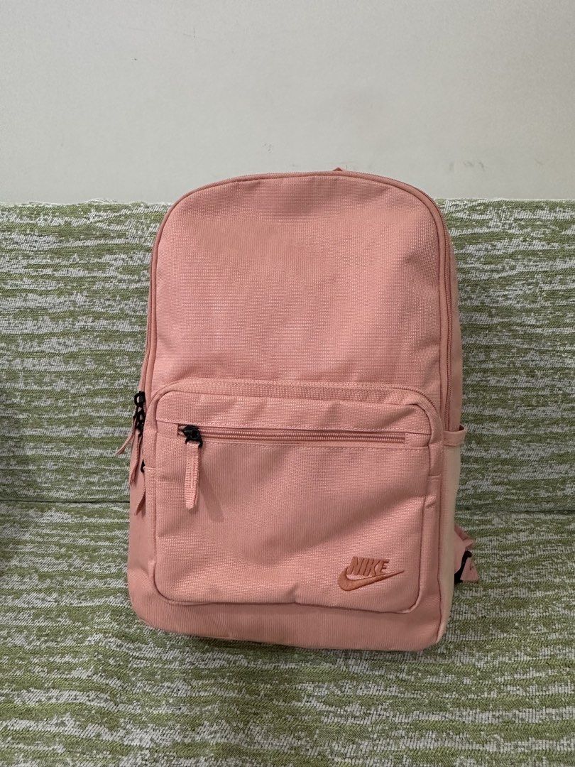 [PRE-LOVED] Nike Heritage Eugene Backpack (Category: Backpacks) located in Mandaluyong City. Submitted by dana.declutters (Listing ID 1461014313, Image 1). Description: Nike Heritage Eugene Backpack in Pink - Water resistant - Comes with three pockets and three main compartments - Capacity: 21L - Can fit a 15” laptop in its dedicated padded laptop compartment - Basic padded shoulder straps.
