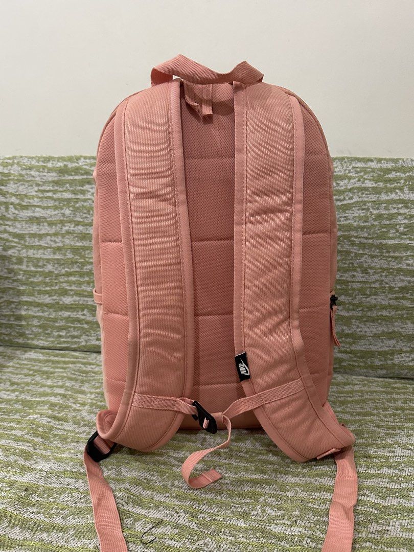 [PRE-LOVED] Nike Heritage Eugene Backpack (Category: Backpacks) located in Mandaluyong City. Submitted by dana.declutters (Listing ID 1461014313, Image 2). Description: Nike Heritage Eugene Backpack in Pink - Water resistant - Comes with three pockets and three main compartments - Capacity: 21L - Can fit a 15” laptop in its dedicated padded laptop compartment - Basic padded shoulder straps.
