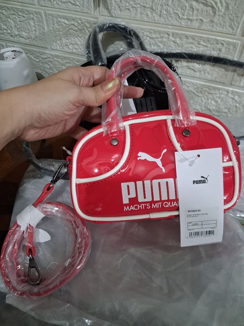 Puma 1976 Micro 1L Grip Bag Red (Category: Cross-body Bags) located in Manila. Submitted by katkween23 (Listing ID 1460960253, Image 3). Description: Super cute mini grip bag from Puma. It's the 1976 Micro 1L model. Bright red patent material with white trim. Has the Puma logo and text. Comes with a detachable shoulder strap. Great for carrying essentials..