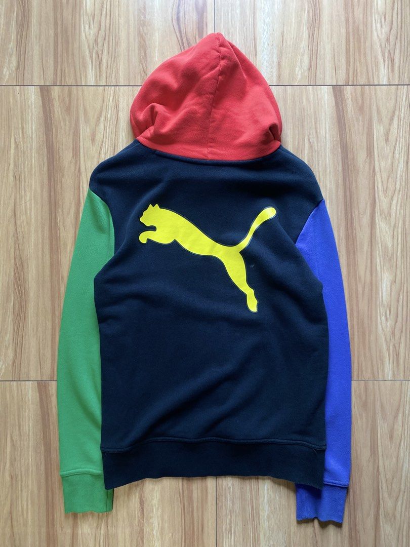Puma Colorblock Hoodie Multicolored (Category: Coats, Jackets and Outerwear) located in Pasig City. Submitted by dopedept_ (Listing ID 1461075930, Image 2). Description: - Eye-catching Puma colorblock hoodie - Vibrant red hood - Classic black body - Contrasting blue and green sleeves - Bold yellow Puma logo on the back - Adjustable drawstring hood for comfort - Convenient front pocket - Ideal for everyday casual wear.