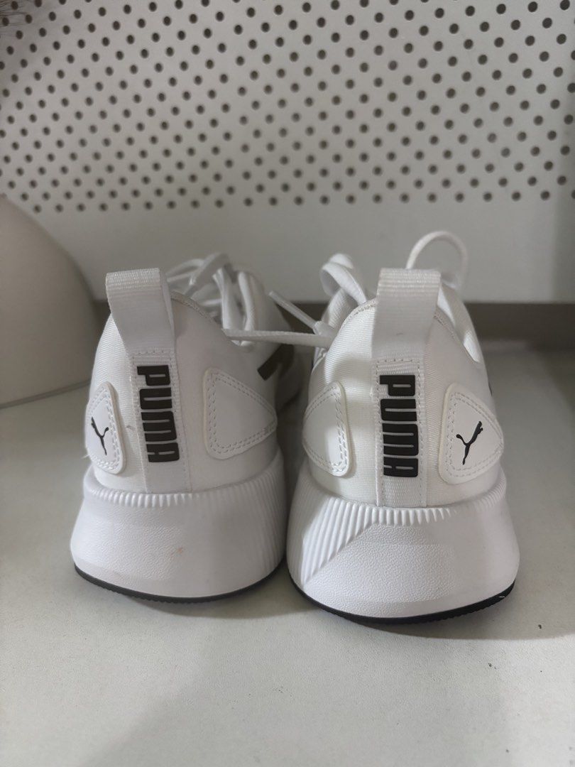 Puma White Running Shoes (Category: Sneakers) located in Rizal. Submitted by callme1sha (Listing ID 1460938039, Image 2). Description: - White Puma sneakers - Black accents - Lace-up closure - Suitable for running or casual wear - Clean and simple design - Ready for a new owner.