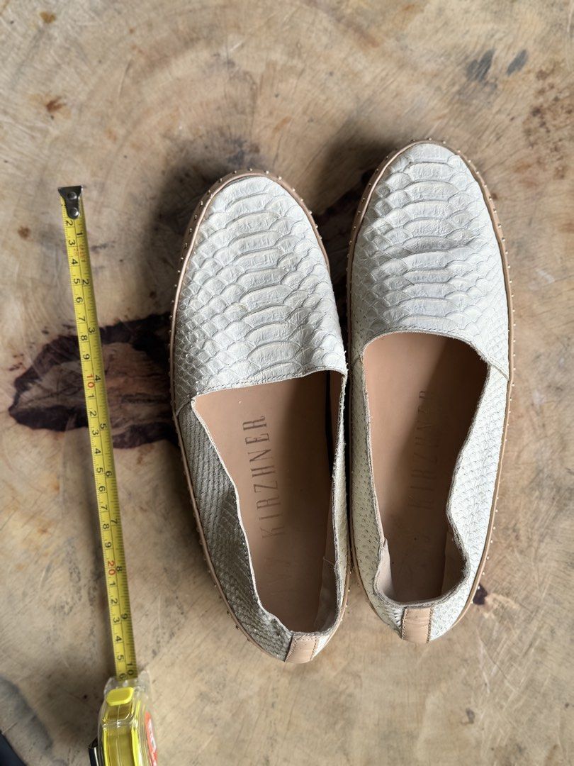 Python Leather Studded Loafers Flats (Category: Flats & Sandals) located in Bacolod City. Submitted by vintage_vogue6100 (Listing ID 1461002826, Image 3). Description: - Material: Genuine Python Leather - Color: Light Cream - Design: Studded trim along the sole - Style: Comfortable slip-on - Versatility: Perfect for dressing up or down, a great wardrobe addition.