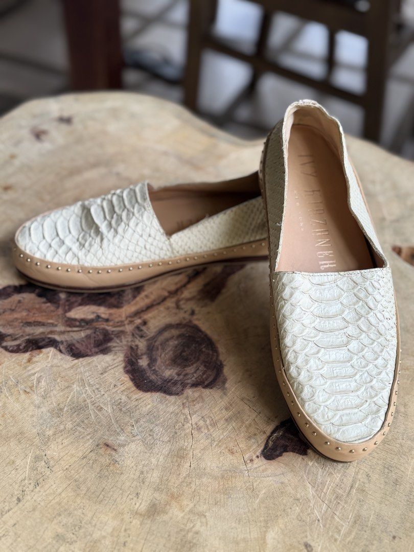 Python Leather Studded Loafers Flats (Category: Flats & Sandals) located in Bacolod City. Submitted by vintage_vogue6100 (Listing ID 1461002826, Image 2). Description: - Material: Genuine Python Leather - Color: Light Cream - Design: Studded trim along the sole - Style: Comfortable slip-on - Versatility: Perfect for dressing up or down, a great wardrobe addition.