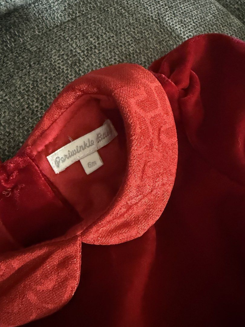 Red Baby Formal Dress - Periwinkle (Category: Babies & Kids Fashion) located in Las Pinas. Submitted by whistlesnowbells (Listing ID 1460965513, Image 2). Description: Used once for an occasion Brand: Periwinkle - Size: 6 months. - Dress features a luxurious velvet top and a brocade skirt with a subtle pattern. - Elegant Peter Pan collar and a sweet bow detail at the waist. - Convenient closure with small pearl buttons at the back. - Ideal for pa