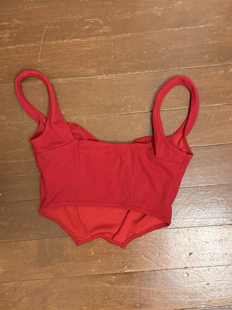 Red Corset Top with Straps (Category: Sleeveless) located in Angeles City. Submitted by lesmiz24601 (Listing ID 1460975612, Image 2). Description: - Stunning red corset top - Adjustable straps for a perfect fit - Flattering sweetheart neckline with ruching - Structured bodice with boning for support - Elegant scalloped hemline - Versatile for dressing up or down.