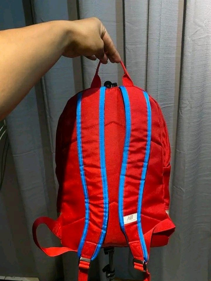 Red New Balance Backpack (Category: Backpacks) located in Manila. Submitted by louiefinds26 (Listing ID 1461021916, Image 3). Description: Color rate 10/10 Good as new Padala from abroad Super ganda pa.