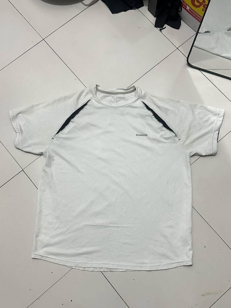 REEBOK white shirt (Category: Tshirts & Polo Shirts ) located in Manila. Submitted by nb_thriftshop (Listing ID 1461082052, Image 1). Description: reeb0k t shirt 27 length 23 width medium to large no issue need wash height 5'5 weight 65 kg .