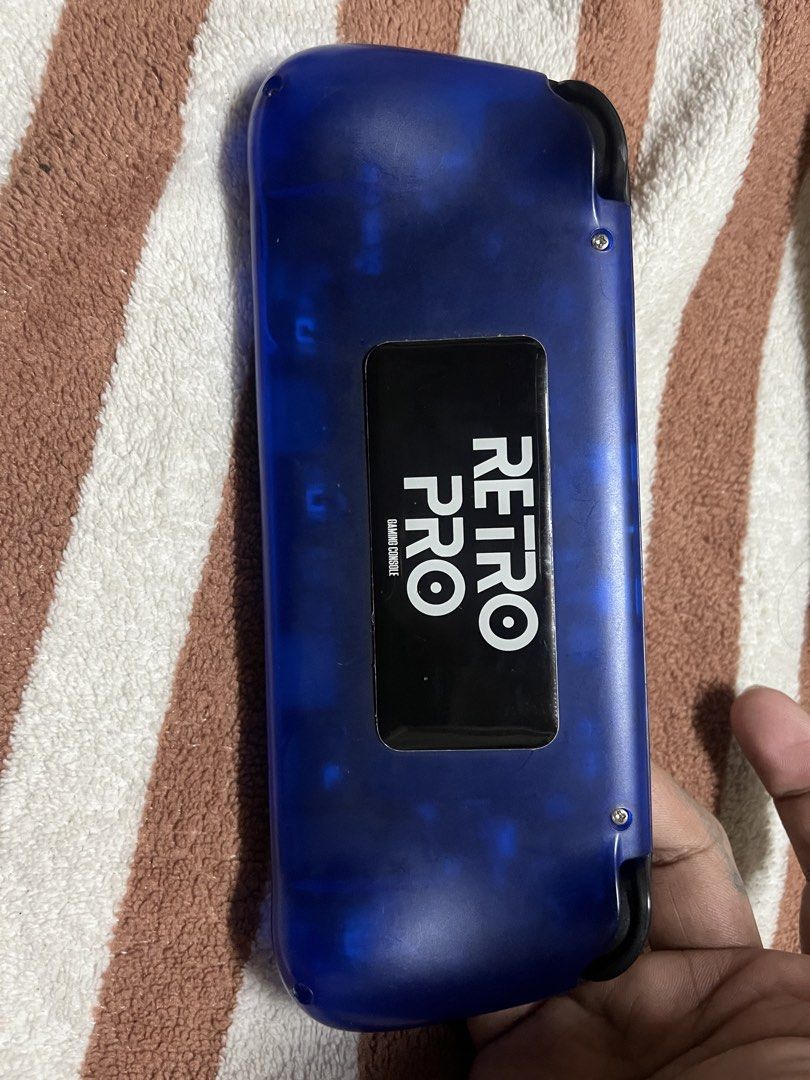 Retro PRO Handheld Game Console - Blue (Category: Others) located in Mandaluyong City. Submitted by flowgie (Listing ID 1461104162, Image 2). Description: retro pro unit only , makinis pa yung screen naka tempered lang yung gasgas , no box no case no charger all working unit . - Blue Retro PRO handheld game console - 5-inch screen - Pre-loaded with Sega Dreamcast and Nintendo Advance games - Features D-pad, analog sticks, and buttons - Ideal for 