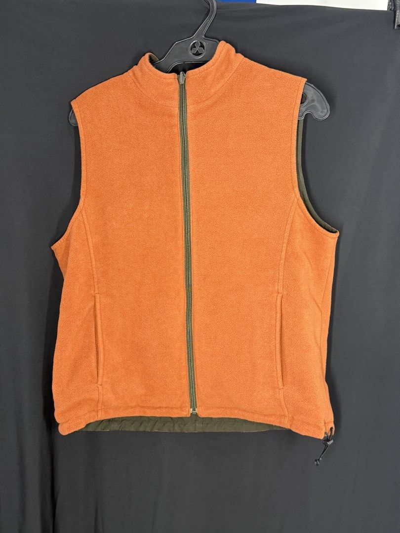 Reversible Olive Green & Orange Fleece Vest (Category: Vests) located in Angeles City. Submitted by lesmiz24601 (Listing ID 1460964321, Image 2). Description: - Two vests in one: Olive green on one side, bright orange fleece on the other. - Full zip closure for easy on and off. - Convenient pockets on both sides. - Perfect for layering and staying warm without bulk. - Lightweight and comfortable..
