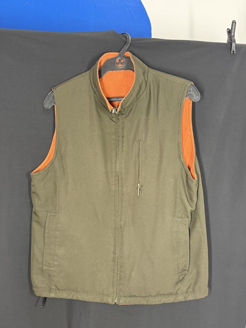 Reversible Olive Green & Orange Fleece Vest (Category: Vests) located in Angeles City. Submitted by lesmiz24601 (Listing ID 1460964321, Image 1). Description: - Two vests in one: Olive green on one side, bright orange fleece on the other. - Full zip closure for easy on and off. - Convenient pockets on both sides. - Perfect for layering and staying warm without bulk. - Lightweight and comfortable..